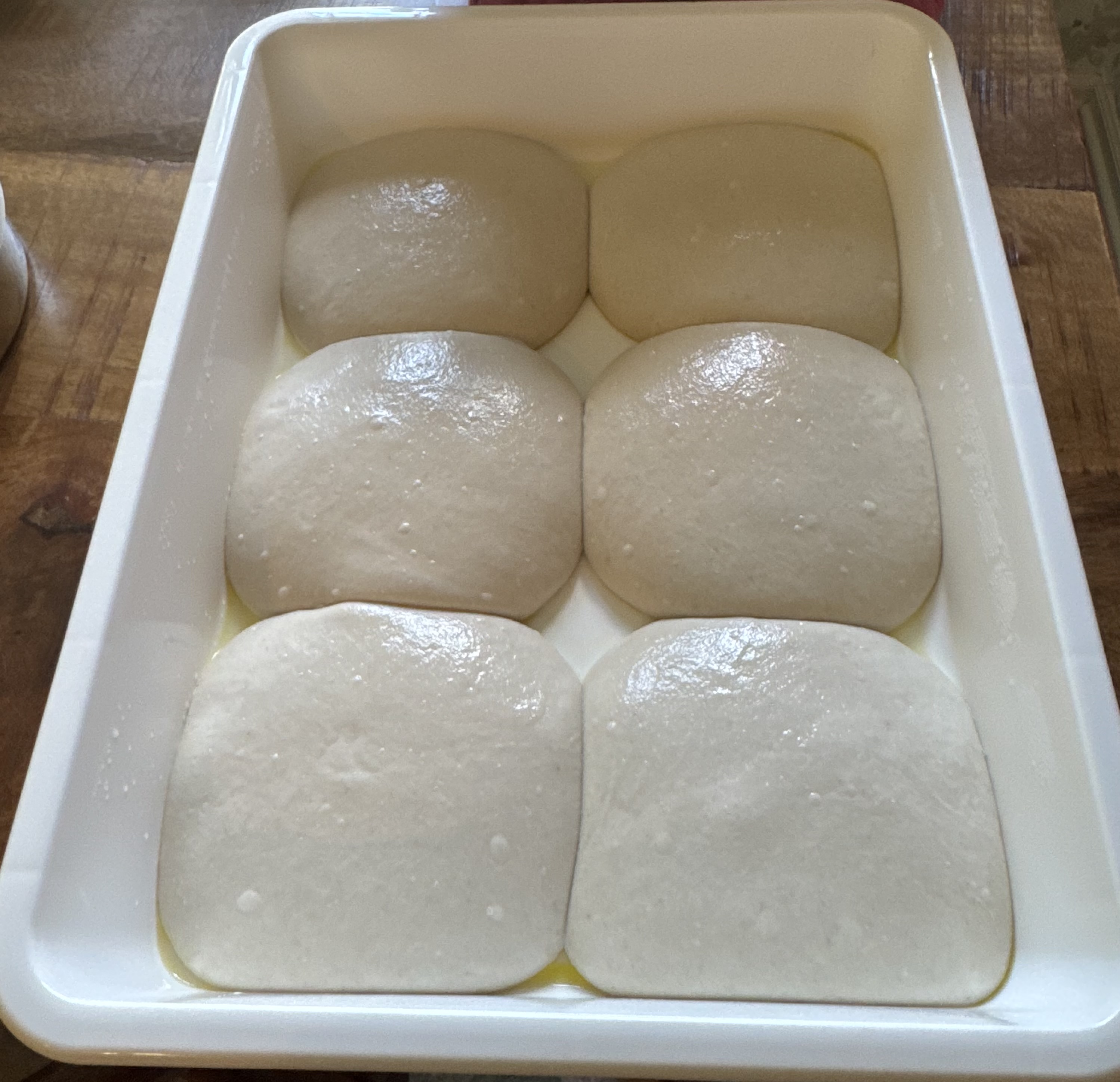 Perfectly proofed pizza dough balls showing artisan craftsmanship